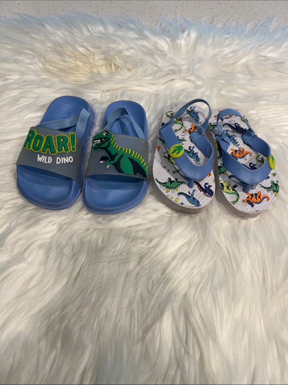 5/$35 2 used pair of Blue Dino Kids Slide Sandals - one is a size 7 & other 5/6